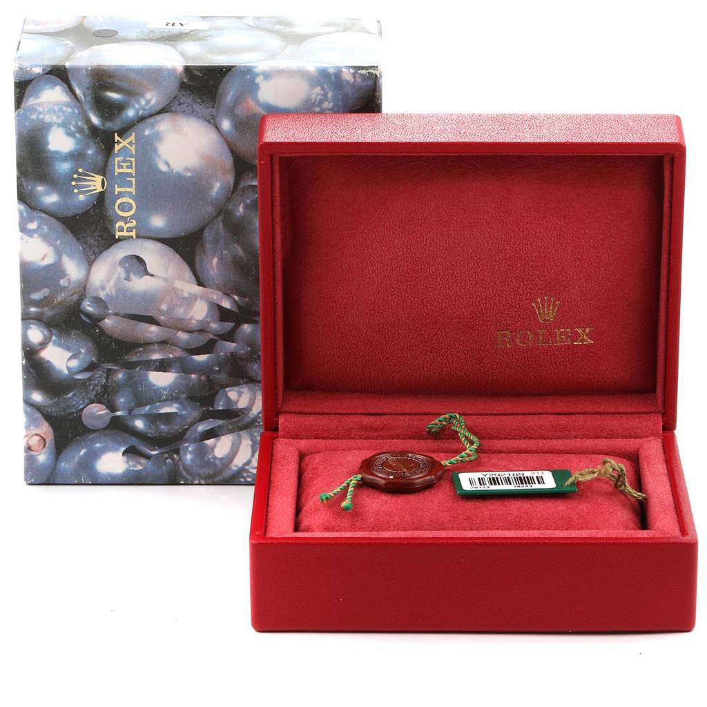 The image shows a Rolex Datejust 79173 Women
s Steel and Gold (two tone) Blue Dial 79173 Women
s Steel and Gold (two tone) Blue Dial watch box, partially open, with certification tags inside.