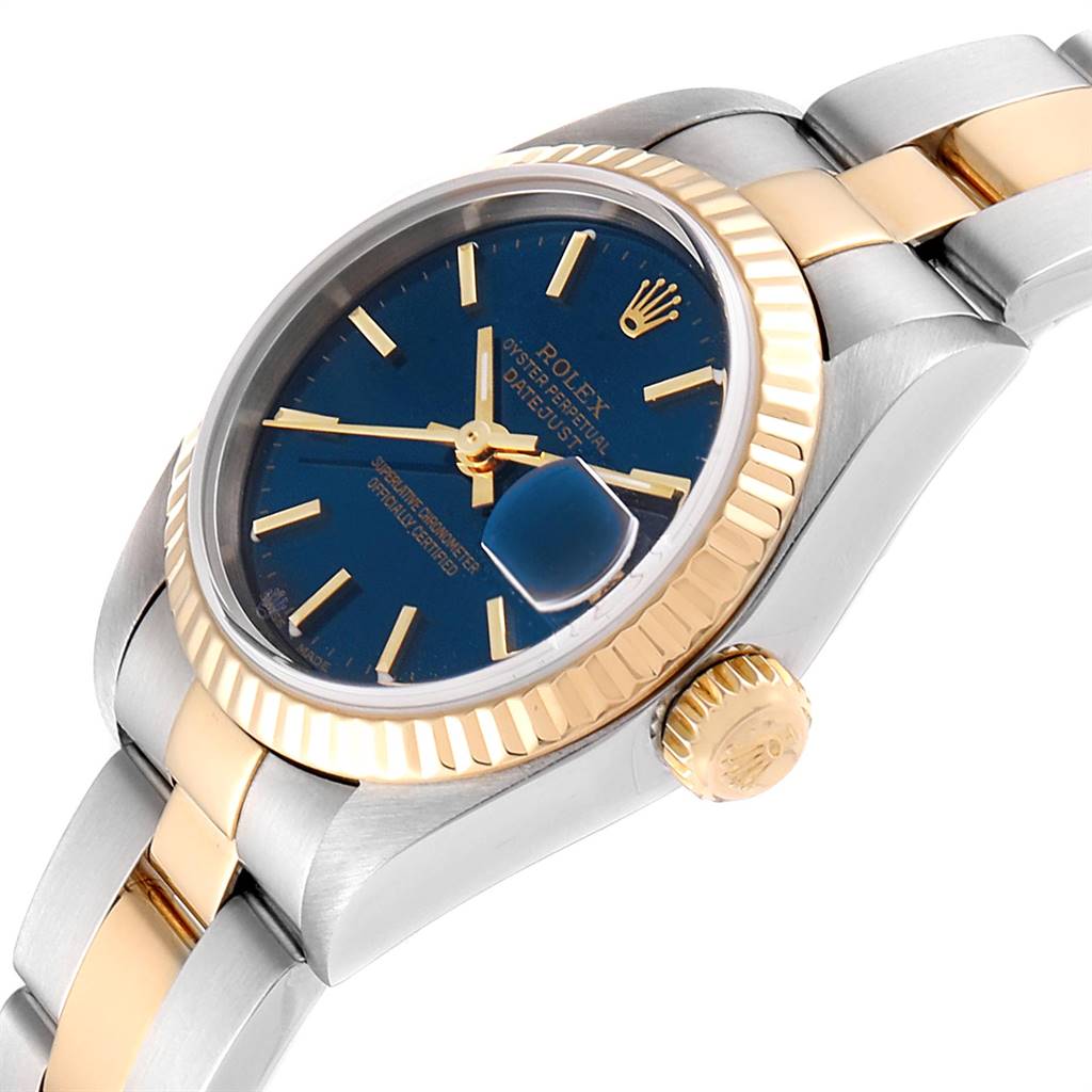 The image shows a side angle of a Rolex Datejust 79173 Women
s Steel and Gold (two tone) Blue Dial 79173 Women
s Steel and Gold (two tone) Blue Dial watch, highlighting the crown, bezel, and part of the bracelet.