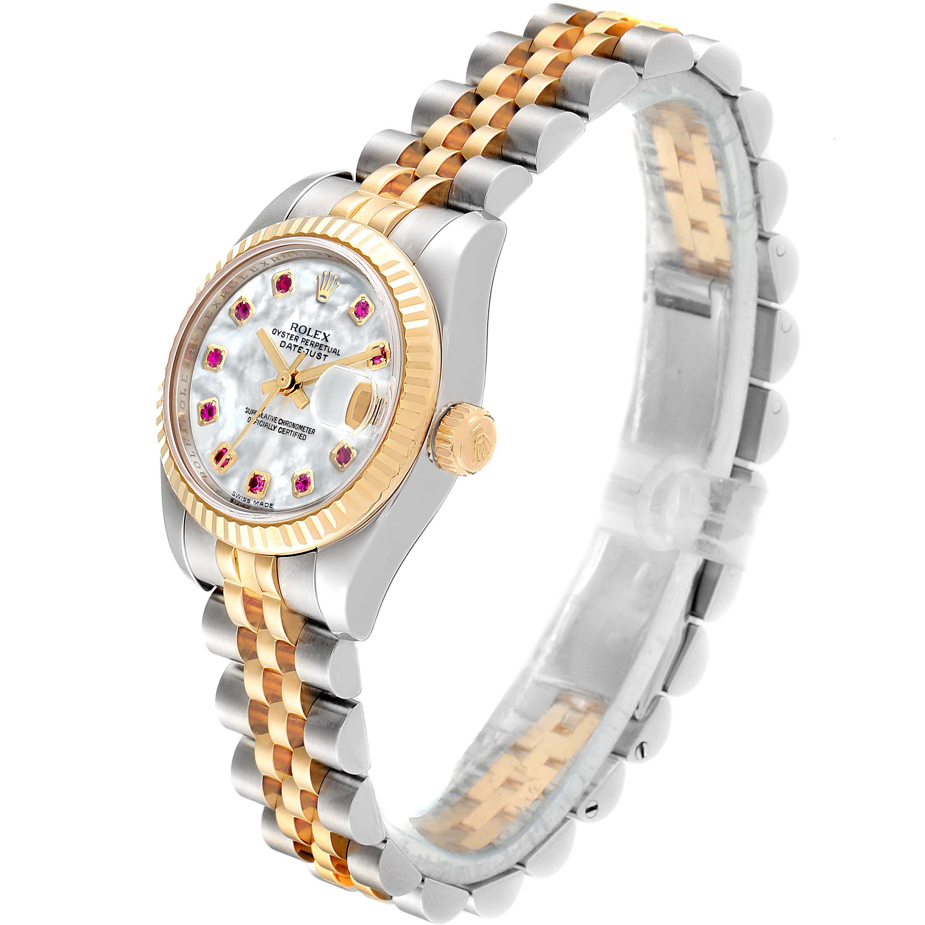 The image shows a Rolex Datejust 179173 Women's Steel and Gold (two tone) Mother of Pearl Dial 179173 Women's Steel and Gold (two tone) Mother of Pearl Dial watch, angled from the side, displaying the bezel, dial with date window, crown, and two-tone bracelet.
