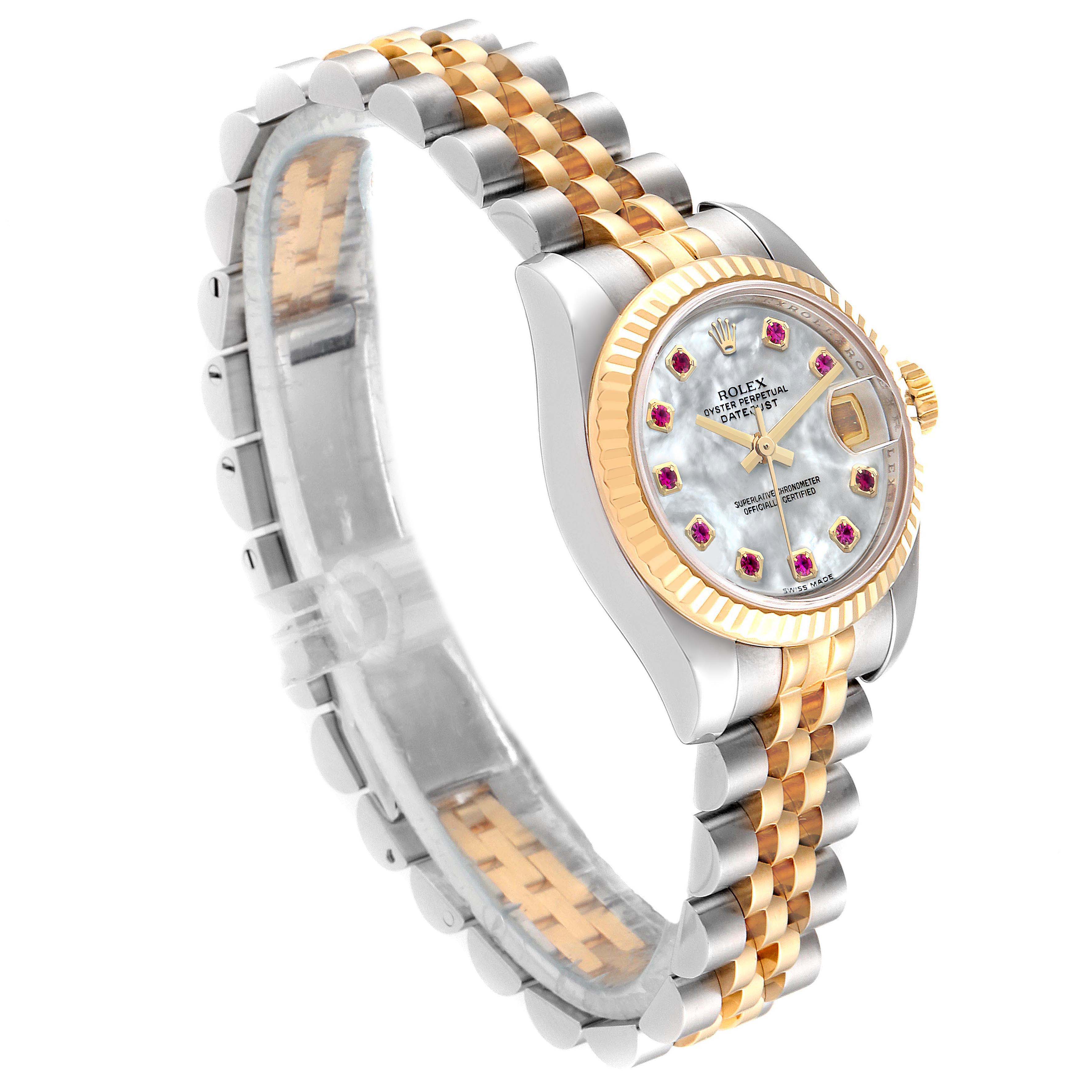 The Rolex Datejust 179173 Women's Steel and Gold (two tone) Mother of Pearl Dial 179173 Women's Steel and Gold (two tone) Mother of Pearl Dial watch is shown at an angled view, displaying the face, bezel, case, and two-tone bracelet.