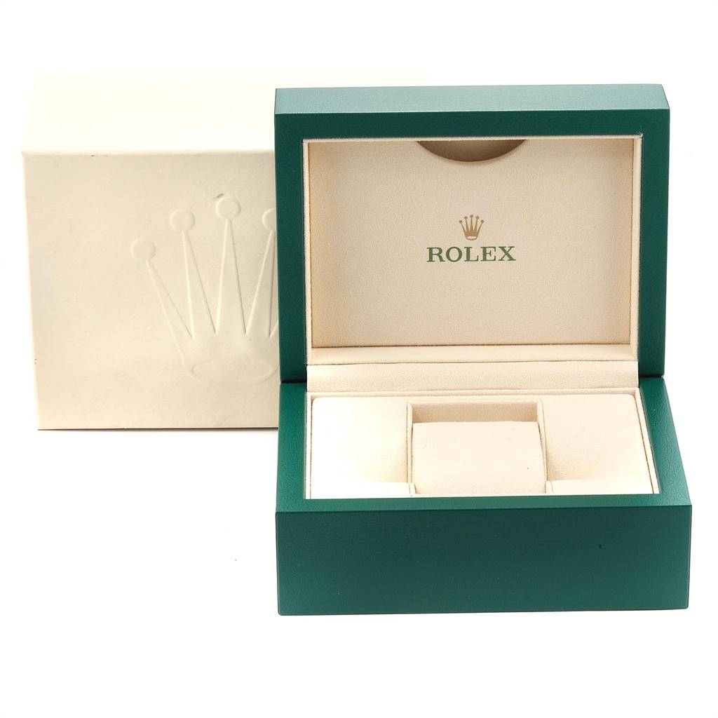 The image shows an open Rolex Datejust 179173 Women's Steel and Gold (two tone) Mother of Pearl Dial 179173 Women's Steel and Gold (two tone) Mother of Pearl Dial watch box with beige interior and green exterior, including the outer white sleeve.