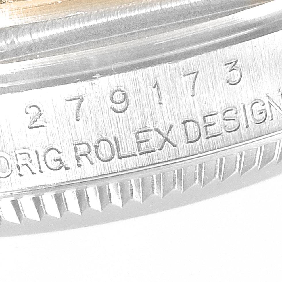 This image shows a close-up of the case side and serial number of a Rolex Datejust 279173 Women's Steel and Gold (two tone) Champagne Dial 279173 Women's Steel and Gold (two tone) Champagne Dial watch.