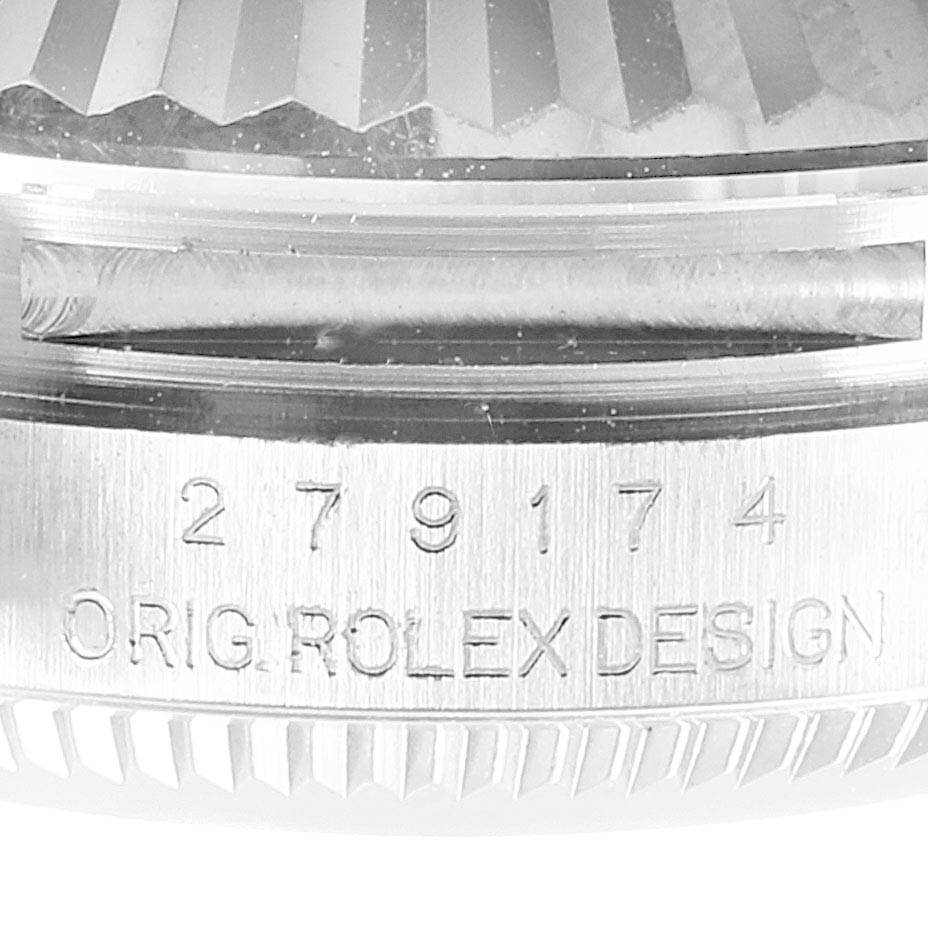 This image shows a close-up of the serial number and "ORIG. ROLEX DESIGN" engraving on the side of a Rolex Datejust 279174 Women's Stainless Steel White Dial 279174 Women's Stainless Steel White Dial watch case.
