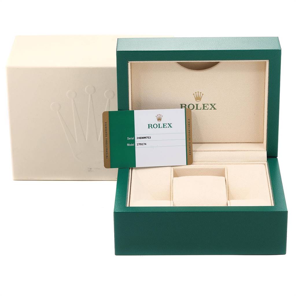 This image shows an open green Rolex Datejust 279174 Women's Stainless Steel White Dial 279174 Women's Stainless Steel White Dial box with a certification card and its outer packaging.