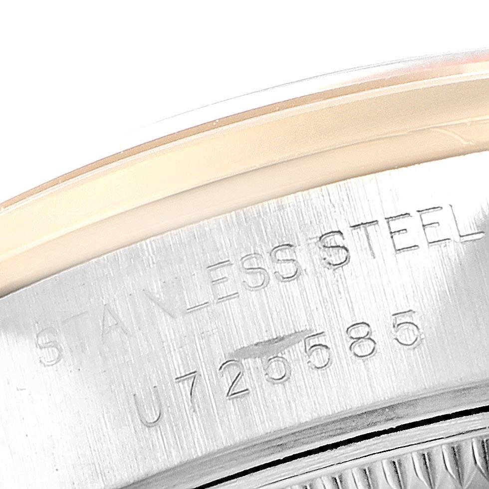 The image shows a close-up of the side of a Rolex Datejust 69163 Women's Stainless Steel Beige Dial 69163 Women's Stainless Steel Beige Dial watch, highlighting the stainless steel material and a serial number.