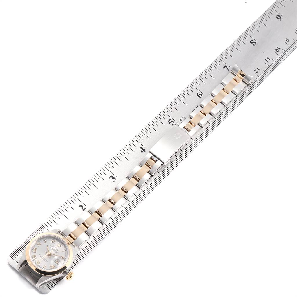 The Rolex Datejust 69163 Women's Steel and Gold (two tone) Grey Dial 69163 Women's Steel and Gold (two tone) Grey Dial watch is shown from the front, aligned with a ruler for measurement.