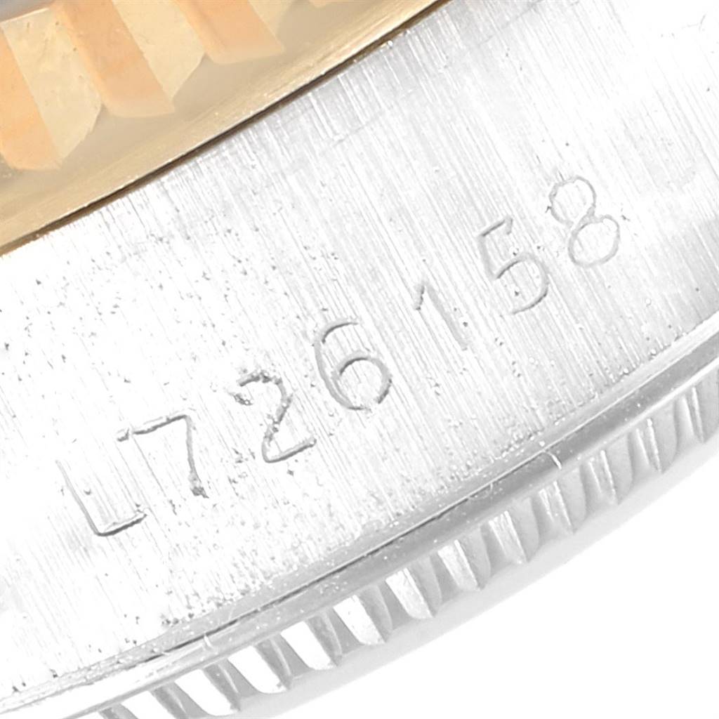 This close-up image shows the serial number engraved on the side of a Rolex Datejust 69173 Women's Stainless Steel Champagne Dial 69173 Women's Stainless Steel Champagne Dial watch case.