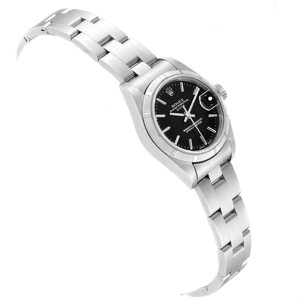 The Rolex Datejust 79190 Women's Stainless Steel Black Dial 79190 Women's Stainless Steel Black Dial watch is shown from an oblique angle, displaying its black dial, bezel, crown, and metal bracelet.