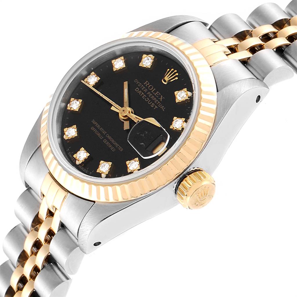 The image shows a Rolex Datejust 79173 Women's Stainless Steel Black Dial 79173 Women's Stainless Steel Black Dial watch angled from the side, highlighting its black dial, gold fluted bezel, and two-tone bracelet.