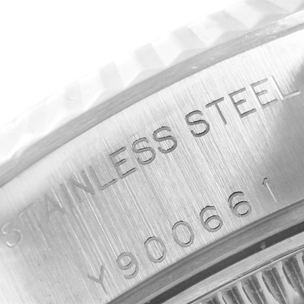 This image shows a close-up of the stainless steel case and serial number on a Rolex Datejust 79174 Women
s Stainless Steel Silver Dial 79174 Women
s Stainless Steel Silver Dial watch.