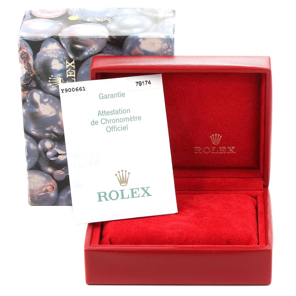 The image shows the packaging and warranty card for a Rolex Datejust 79174 Women
s Stainless Steel Silver Dial 79174 Women
s Stainless Steel Silver Dial watch, including a branded box and certificate.
