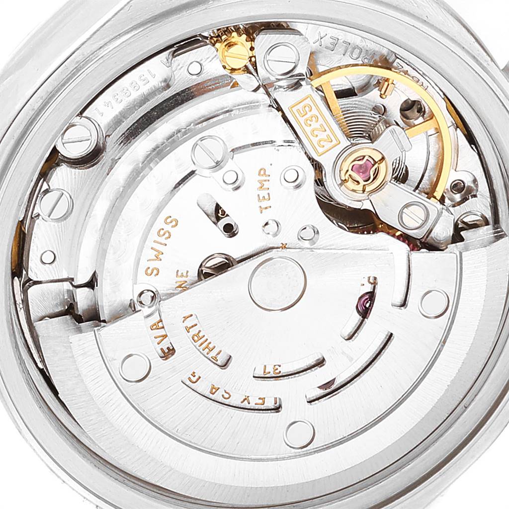 The image shows the intricate internal mechanism of a Rolex Datejust 79174 Women
s Stainless Steel Mother of Pearl Dial 79174 Women
s Stainless Steel Mother of Pearl Dial watch from a close-up angle.