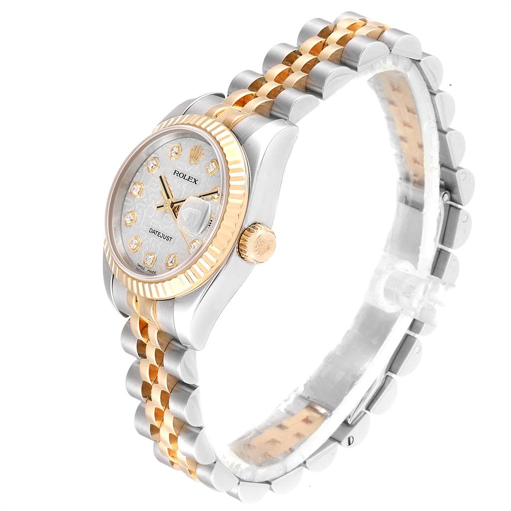 This image shows a side angle view of a Rolex Datejust 179173 Women's Steel and Gold (two tone) Silver Dial 179173 Women's Steel and Gold (two tone) Silver Dial watch, highlighting its two-tone bracelet and fluted bezel.