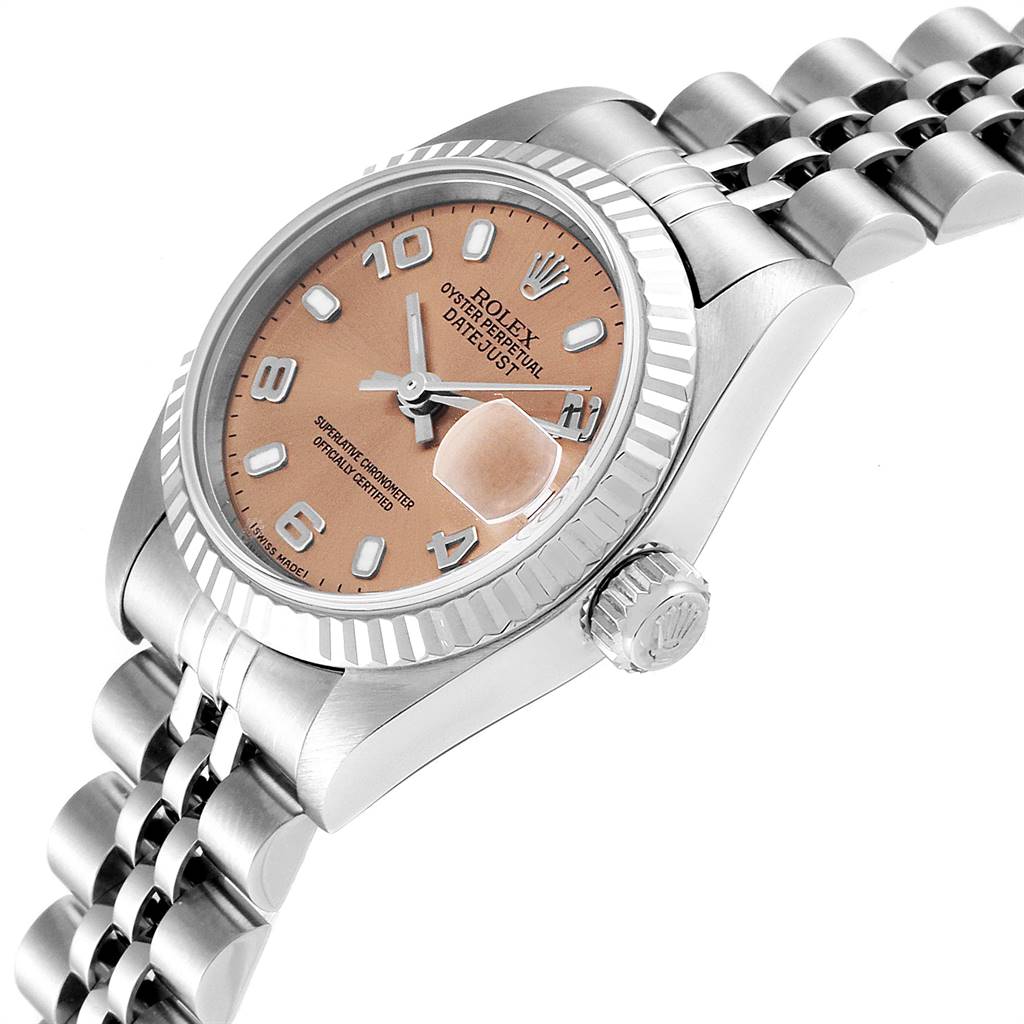 The Rolex Datejust 79174 Women's Stainless Steel Pink Dial 79174 Women's Stainless Steel Pink Dial watch is shown at a slightly tilted angle featuring its dial, fluted bezel, and part of the bracelet.