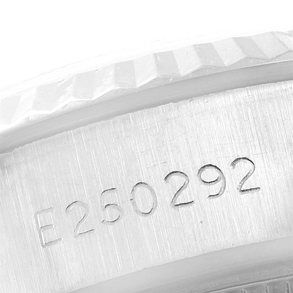 This close-up angle of the Rolex Datejust 69174 Women
s Stainless Steel Silver Dial 69174 Women
s Stainless Steel Silver Dial watch shows the serial number engraving on the side of the case.