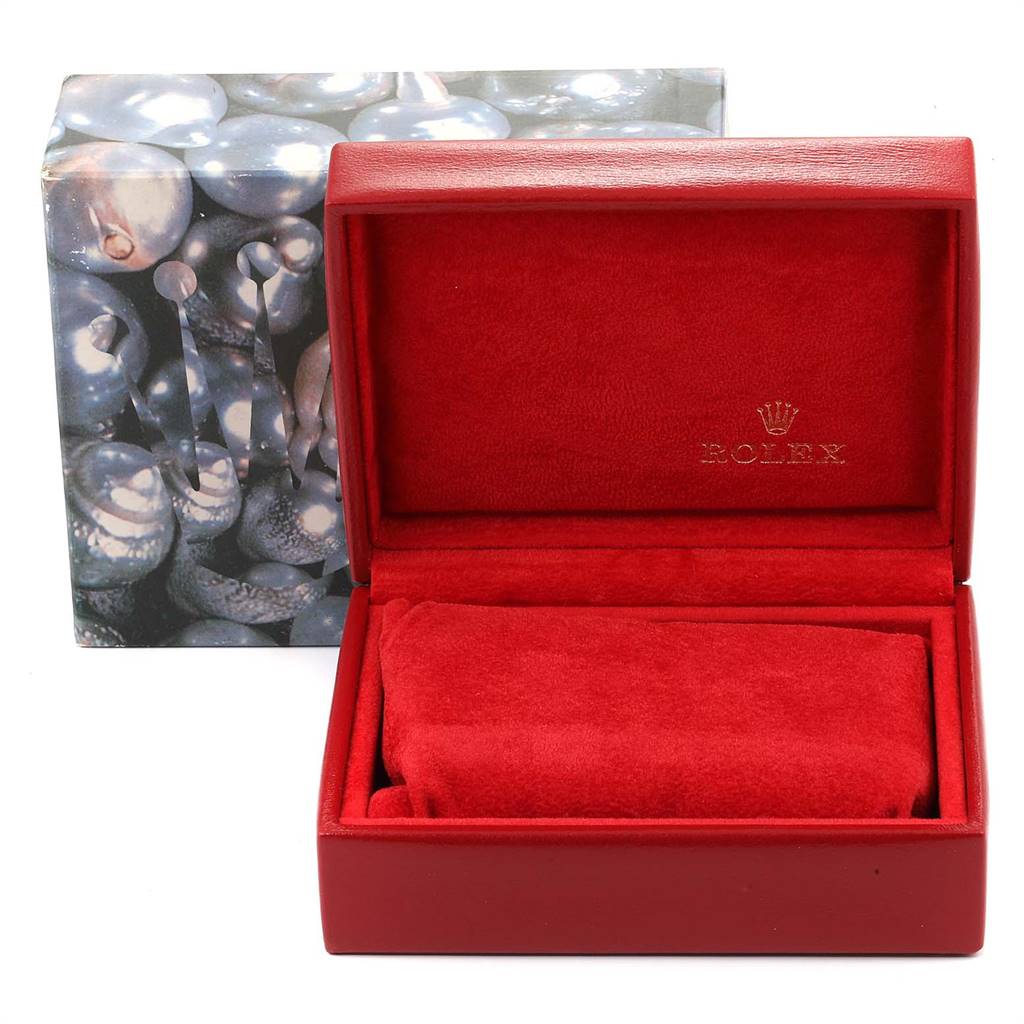 The image shows an empty Rolex Datejust 69174 Women
s Stainless Steel Silver Dial 69174 Women
s Stainless Steel Silver Dial watch box with a red interior and an outer box with a pearl-like design.