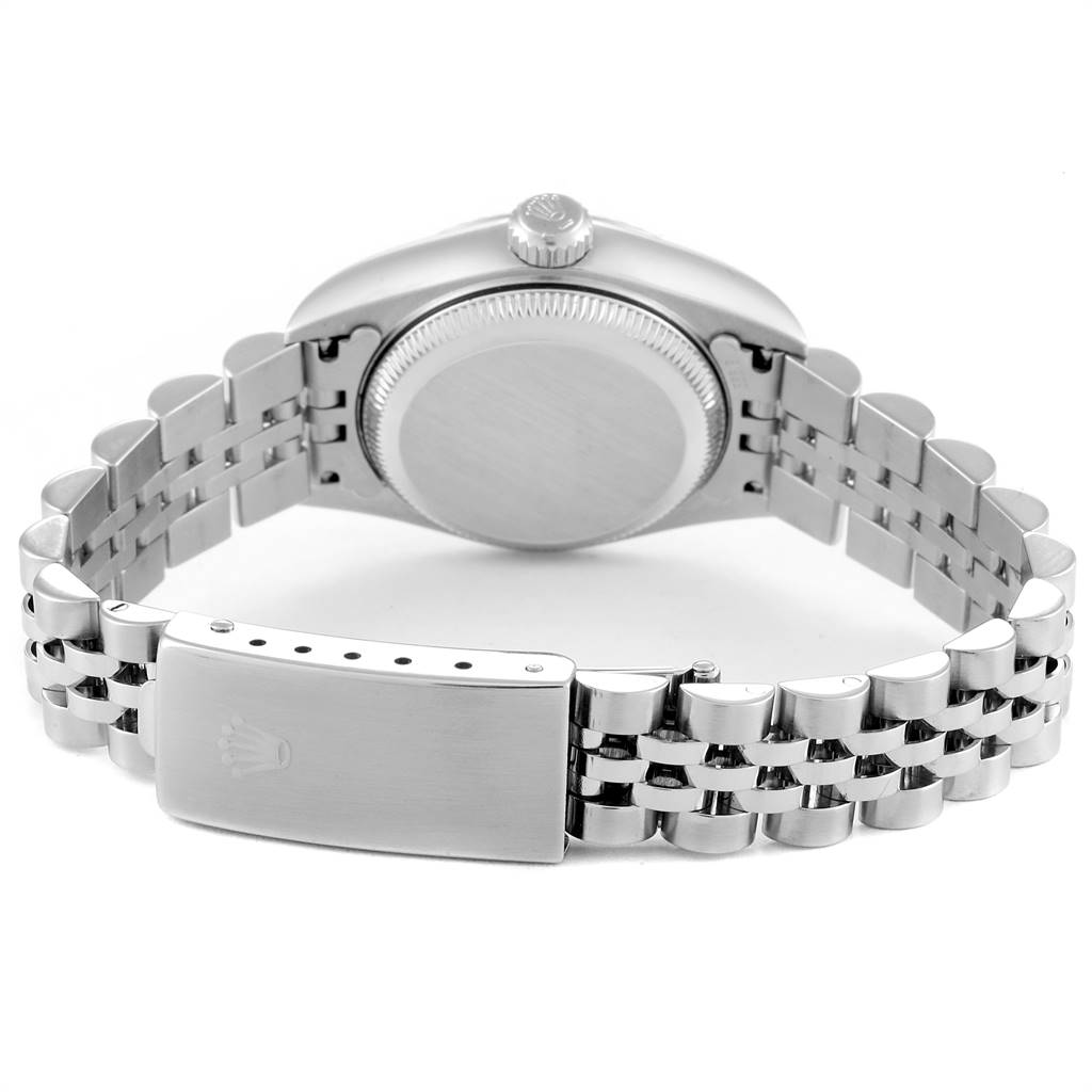 The image shows the back case, crown, and bracelet clasp of a Rolex Datejust 79174 Women's Stainless Steel Blue Dial 79174 Women's Stainless Steel Blue Dial watch.