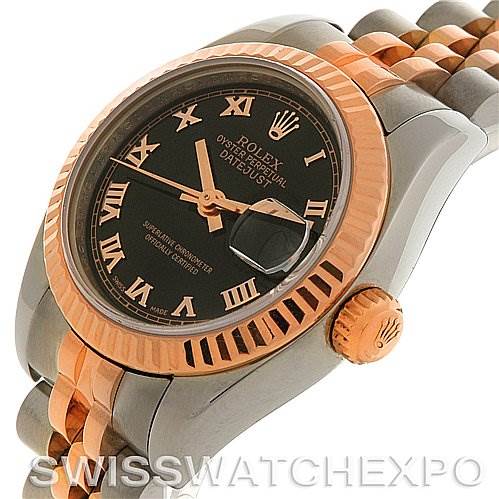 This image shows a Rolex Datejust 179171 Women's Steel and Gold (two tone) Black Dial 179171 Women's Steel and Gold (two tone) Black Dial watch at an angled view, highlighting the bezel, crown, bracelet, and part of the dial.