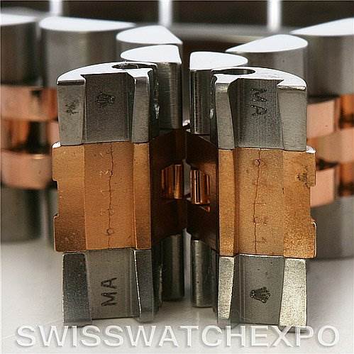 This image shows a close-up view of Rolex Datejust 179171 Women's Steel and Gold (two tone) Black Dial 179171 Women's Steel and Gold (two tone) Black Dial watch links in stainless steel and rose gold.