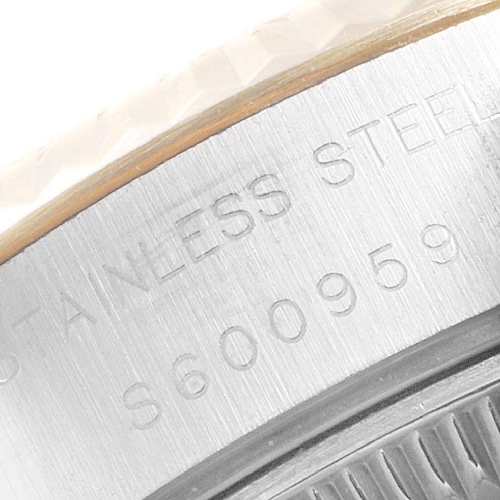 The image shows a close-up of the serial number engraving and the stainless steel marking on the casing of a Rolex Datejust 69173 Women
s Stainless Steel Champagne Dial 69173 Women
s Stainless Steel Champagne Dial watch.