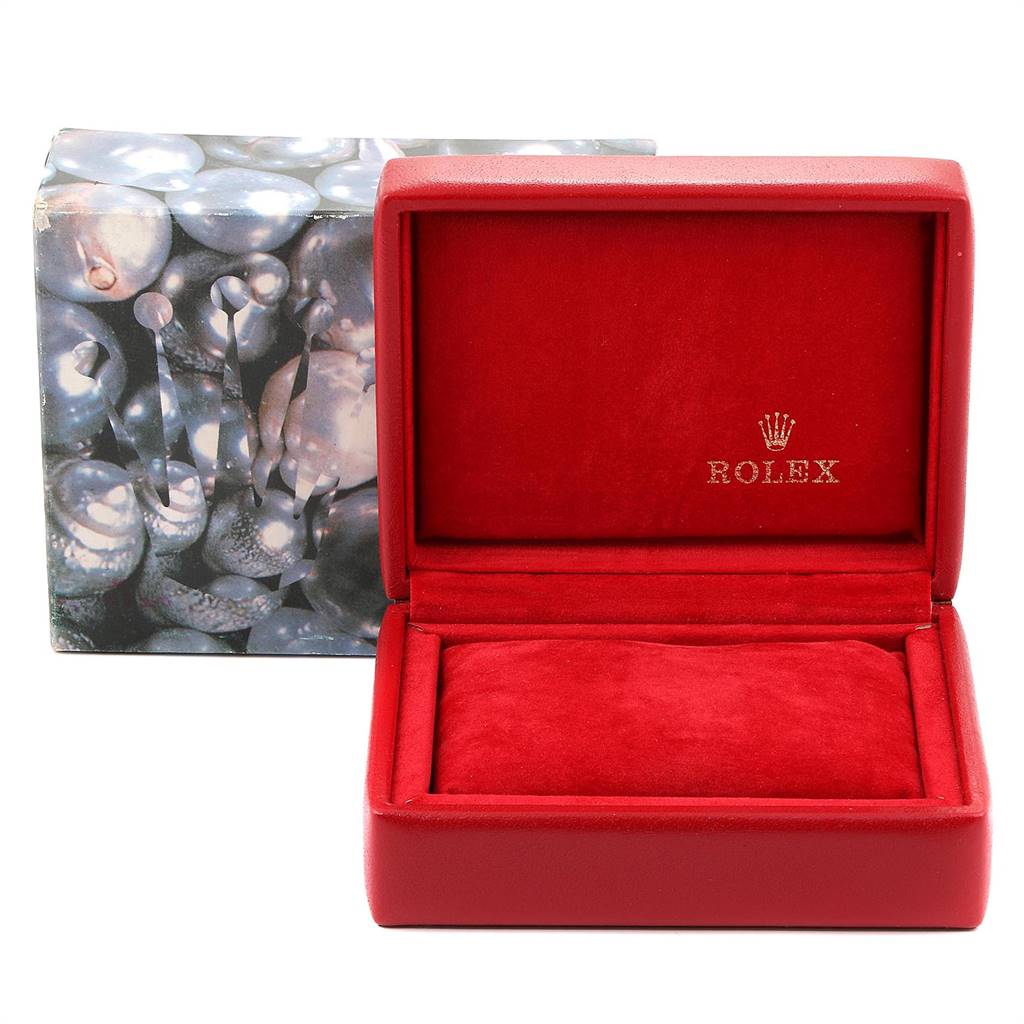 The image shows a red Rolex watch box for the Datejust model, open, with a decorative outer box behind it.