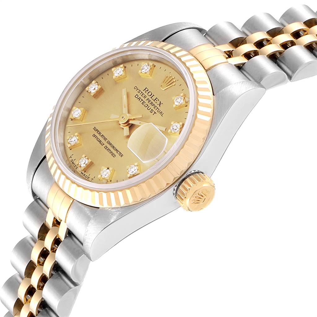 This image shows a side angle of a Rolex Datejust 69173 Women
s Stainless Steel Champagne Dial 69173 Women
s Stainless Steel Champagne Dial, highlighting its dial, fluted bezel, and part of the jubilee bracelet.