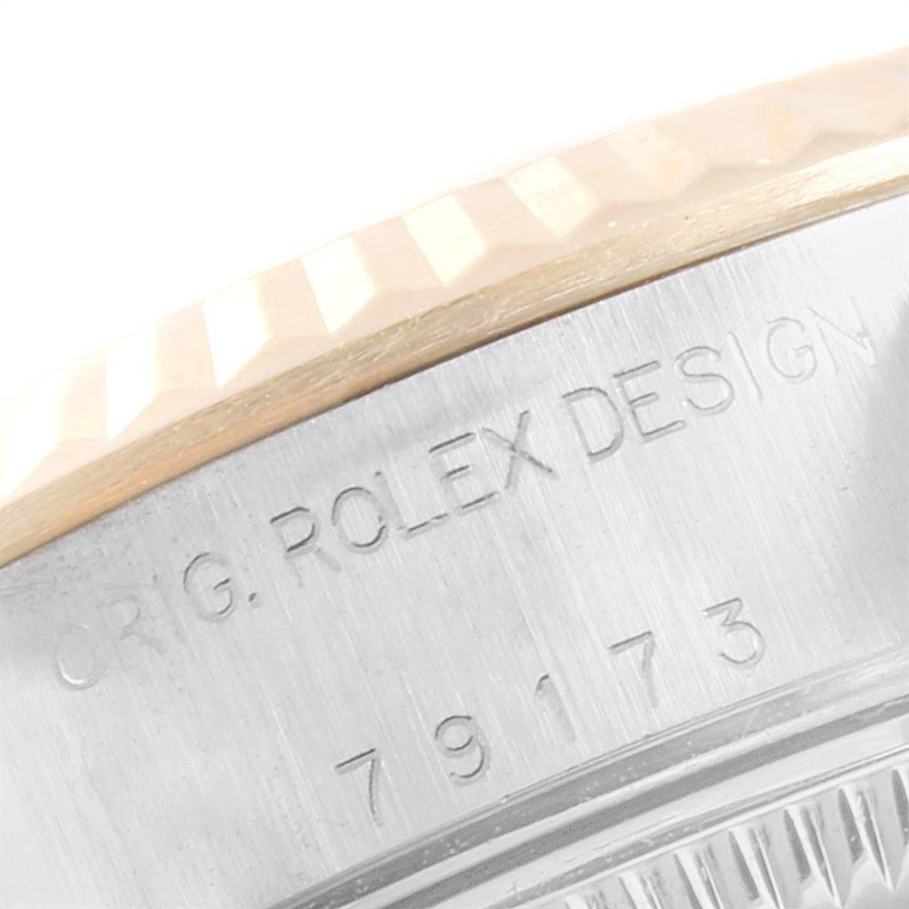 The image shows a close-up of the case side and fluted bezel with the engraving of the Rolex Datejust 79173 Women's Stainless Steel Mother of Pearl Dial 79173 Women's Stainless Steel Mother of Pearl Dial model.