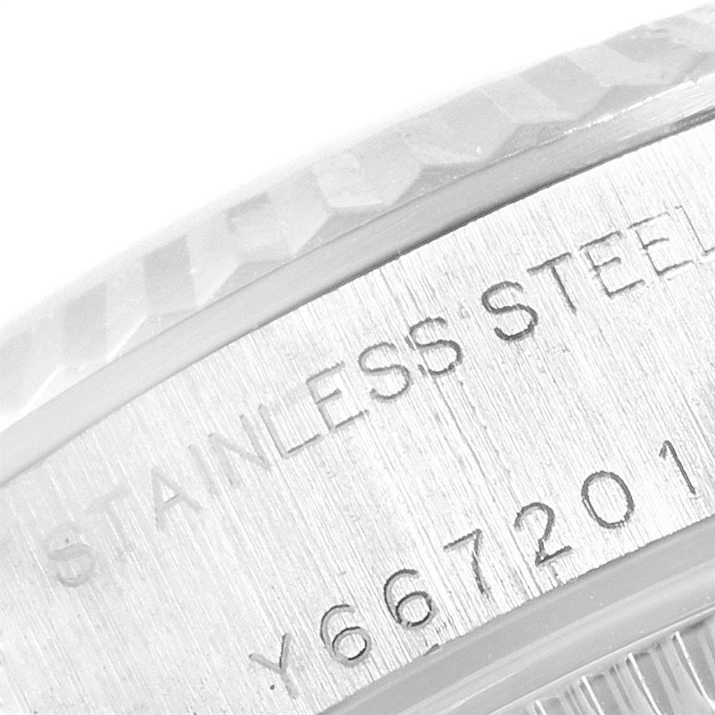 This image shows a close-up of the stainless steel case back and serial number of a Rolex Datejust 79174 Women
s Stainless Steel Mother of Pearl Dial 79174 Women
s Stainless Steel Mother of Pearl Dial watch.