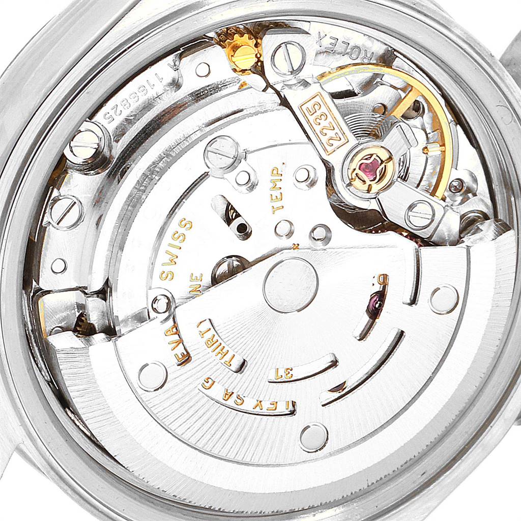 This image shows a close-up of the movement mechanism inside a Rolex Datejust 79174 Women
s Stainless Steel Mother of Pearl Dial 79174 Women
s Stainless Steel Mother of Pearl Dial watch, highlighting its intricate parts.