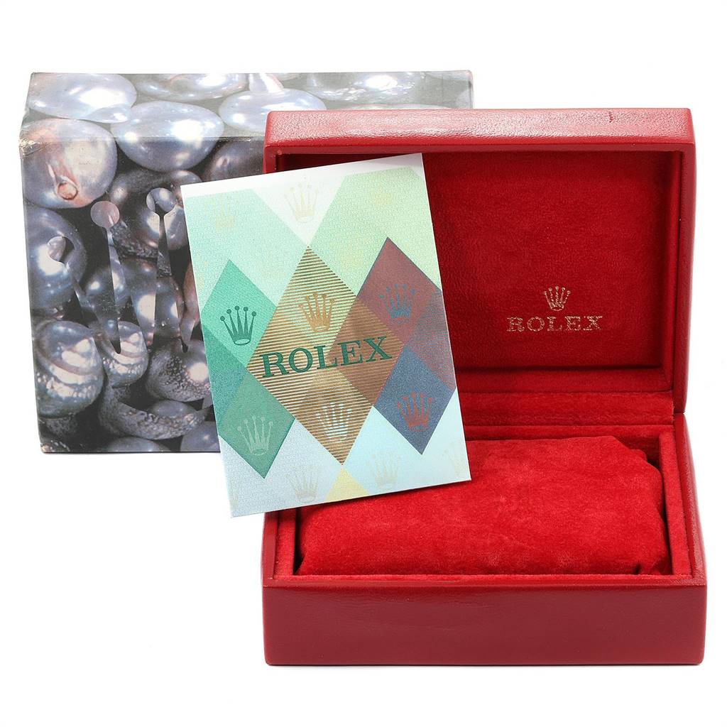 This image shows a red Rolex Datejust 79174 Women's Stainless Steel Pink Dial 79174 Women's Stainless Steel Pink Dial watch box and an accompanying booklet, viewed from an angle facing the open box.