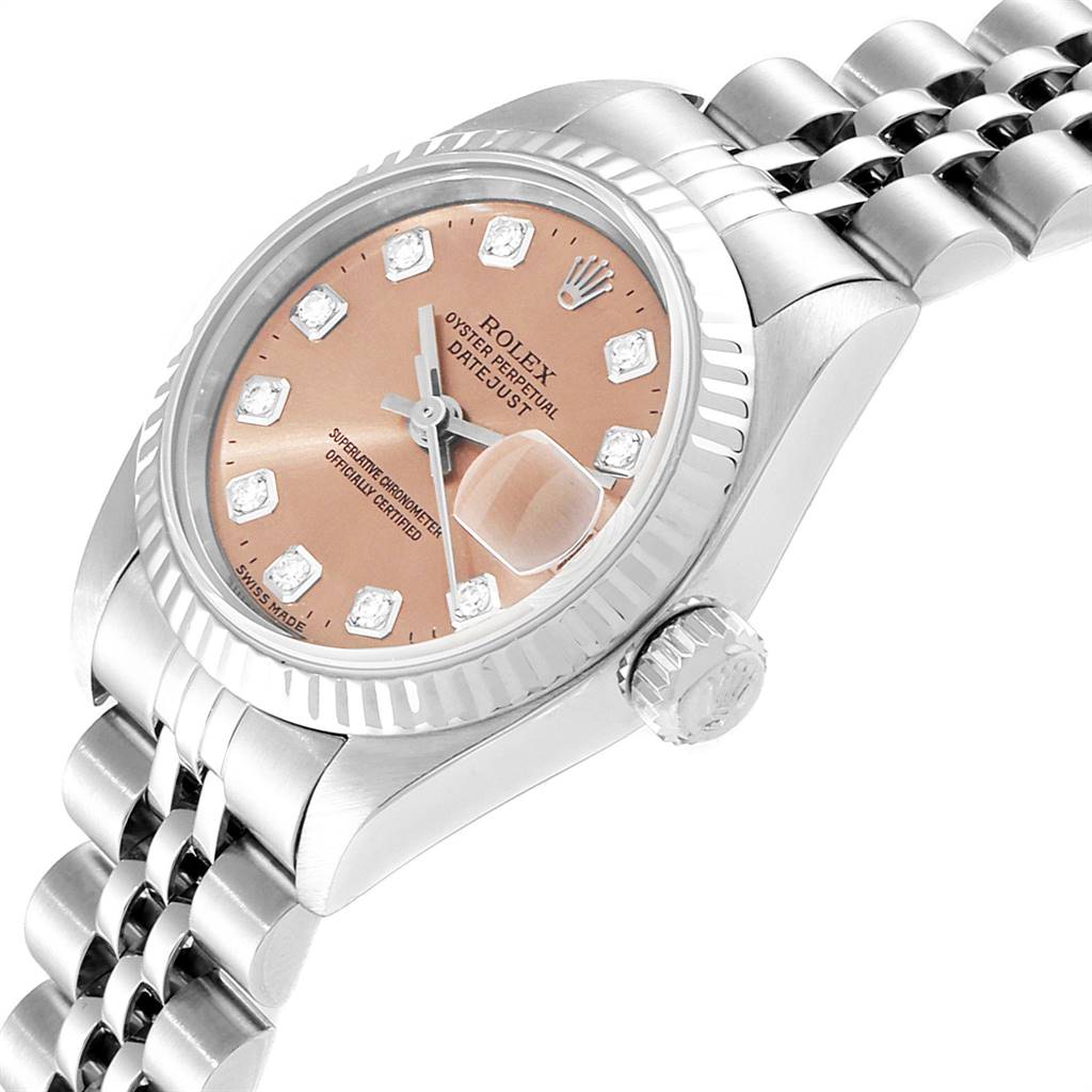 The image shows a close-up angle of the Rolex Datejust 79174 Women's Stainless Steel Pink Dial 79174 Women's Stainless Steel Pink Dial watch, highlighting the dial, bezel, and part of the bracelet.