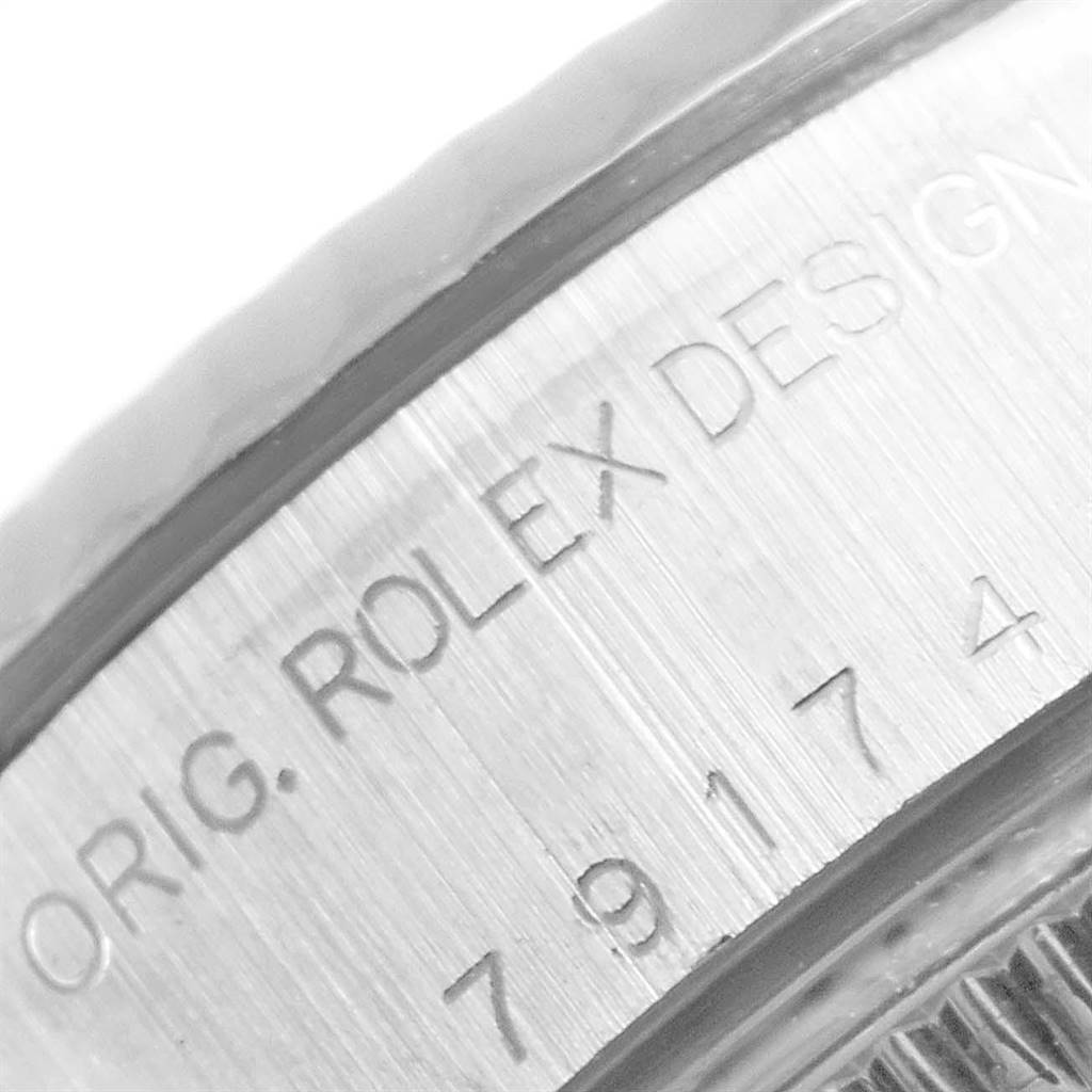 This close-up image shows the side engraving on the case of a Rolex Datejust 79174 Women
s Stainless Steel Silver Dial 79174 Women
s Stainless Steel Silver Dial watch.