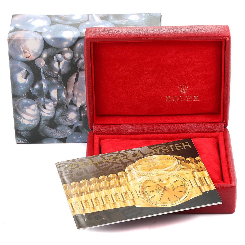 This image shows a Rolex Datejust 79174 Women
s Stainless Steel Silver Dial 79174 Women
s Stainless Steel Silver Dial watch box, along with an open manual or booklet inside.