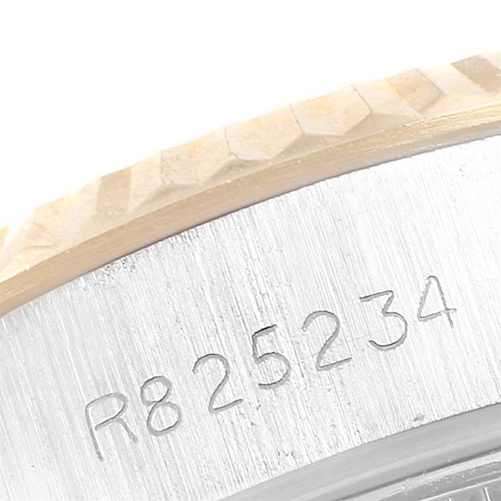 This image shows the serial number engraving on the side of the Rolex Datejust 69173 Women's Stainless Steel Champagne Dial 69173 Women's Stainless Steel Champagne Dial watch case.