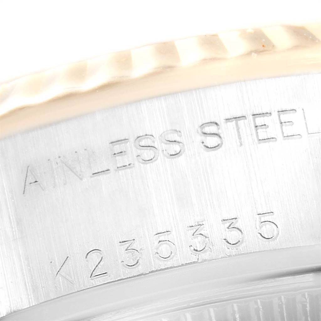 This close-up image shows the serial number and part of the bezel of a Rolex Datejust 79173 Women's Stainless Steel White Dial 79173 Women's Stainless Steel White Dial watch.