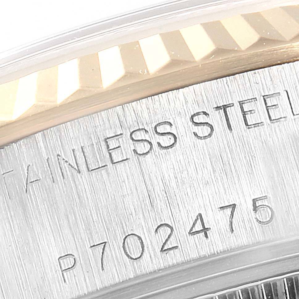 The image shows a close-up of the serial number and part of the fluted bezel on a Rolex Datejust 79173 Women's Stainless Steel Mother of Pearl Dial 79173 Women's Stainless Steel Mother of Pearl Dial watch.