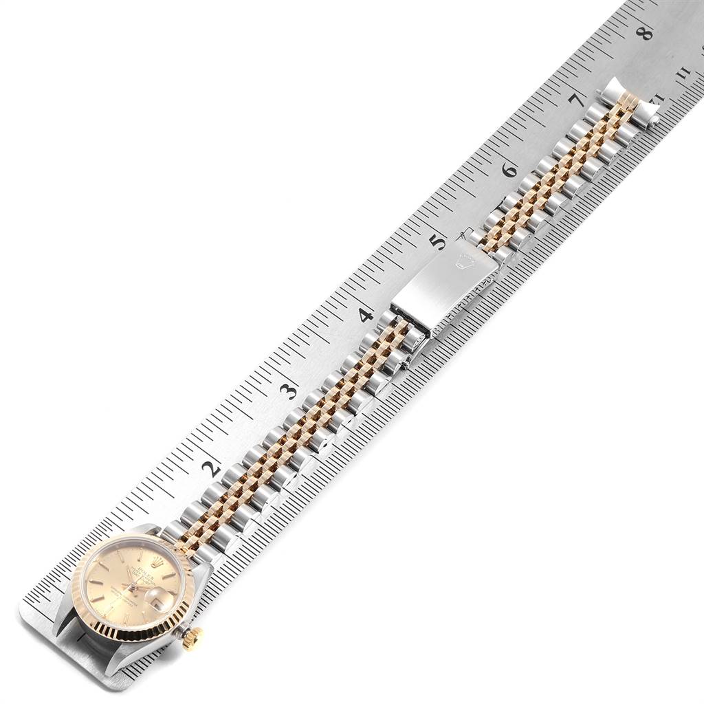 The image shows a Rolex Datejust 69173 Women's Stainless Steel Champagne Dial 69173 Women's Stainless Steel Champagne Dial watch laid flat next to a ruler, highlighting the face and bracelet.