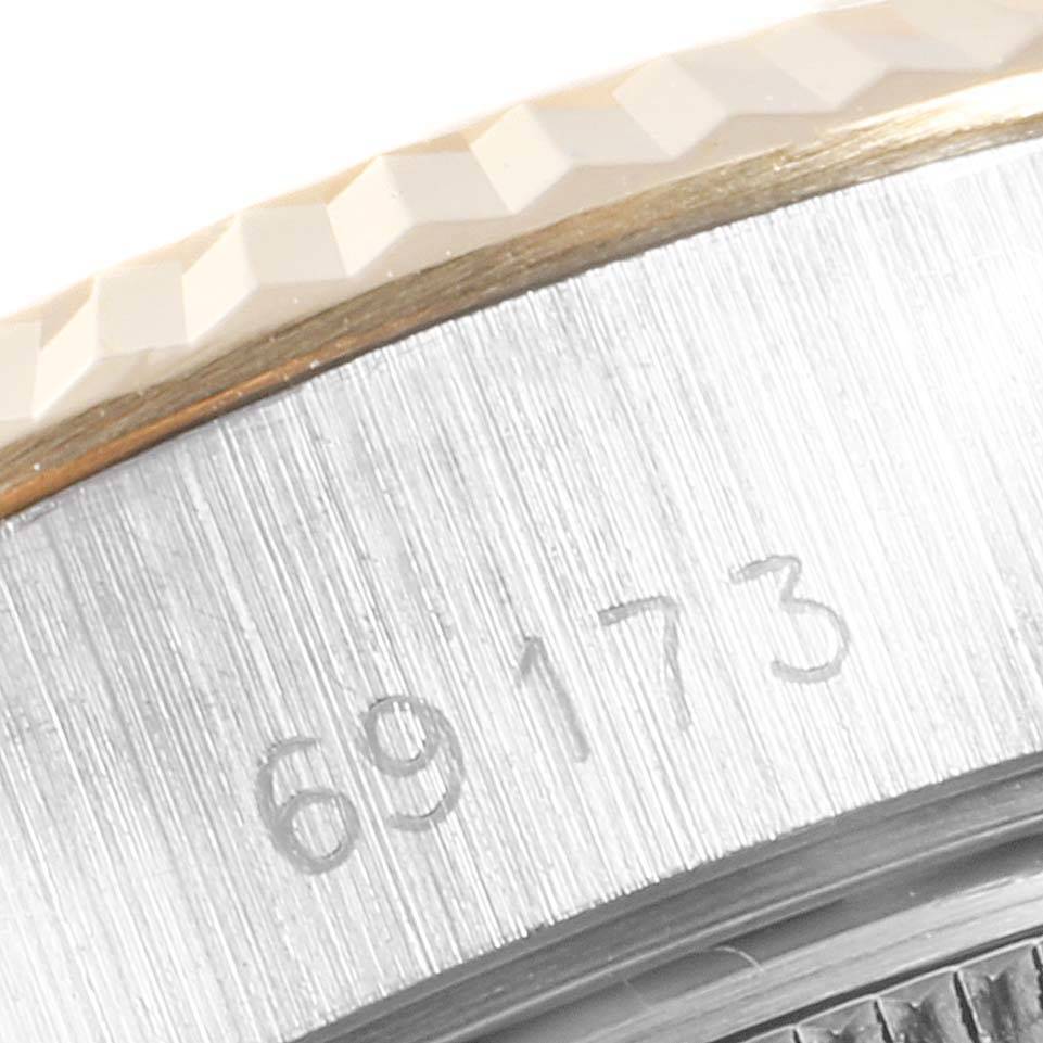 The image shows a close-up of the case and fluted bezel of a Rolex Datejust 69173 Women's Stainless Steel Champagne Dial 69173 Women's Stainless Steel Champagne Dial with the model number 69173.