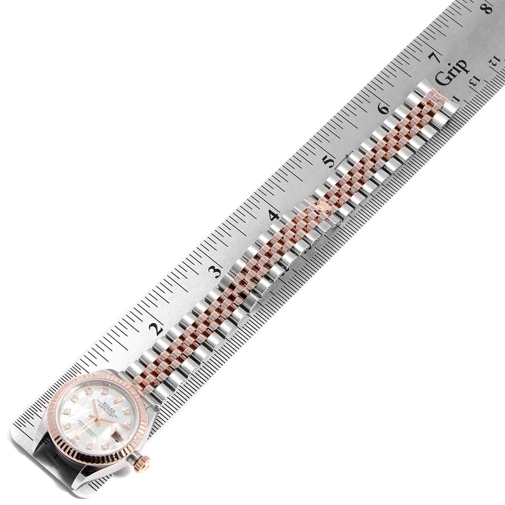 The image shows a Rolex Datejust 279171 Women
s Steel and Gold (two tone) Mother of Pearl Dial 279171 Women
s Steel and Gold (two tone) Mother of Pearl Dial watch laying flat with a ruler measuring its bracelet length.