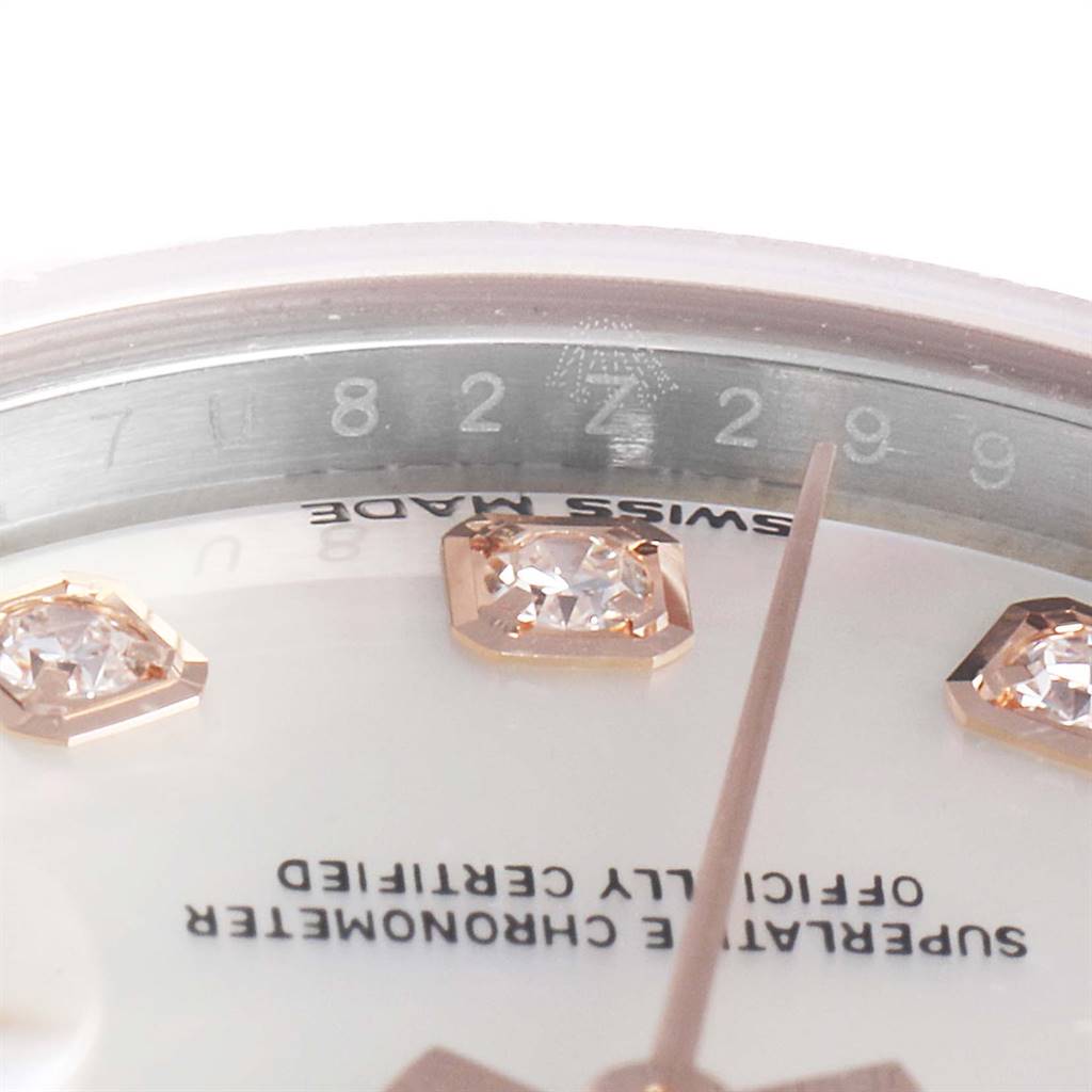 This close-up angle of the Rolex Datejust 279171 Women
s Steel and Gold (two tone) Mother of Pearl Dial 279171 Women
s Steel and Gold (two tone) Mother of Pearl Dial watch shows the watch face, diamond hour markers, and part of the "Swiss Made" text.