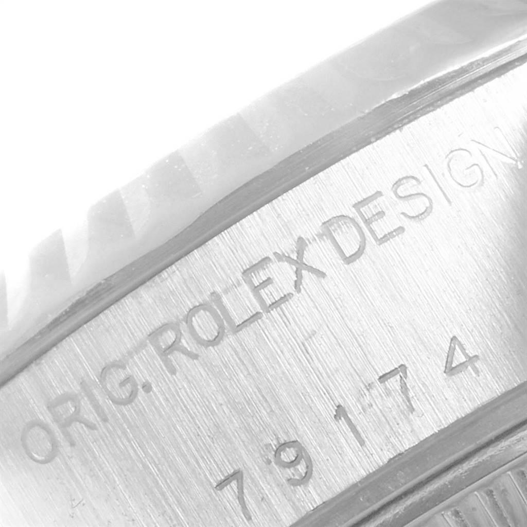 This image shows a detailed close-up of the engraved side of a Rolex Datejust 79174 Women's Stainless Steel White Dial 79174 Women's Stainless Steel White Dial watch.
