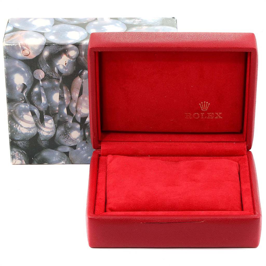 The image shows an empty red watch box with the Rolex logo, used for the Datejust model, along with its themed outer box.