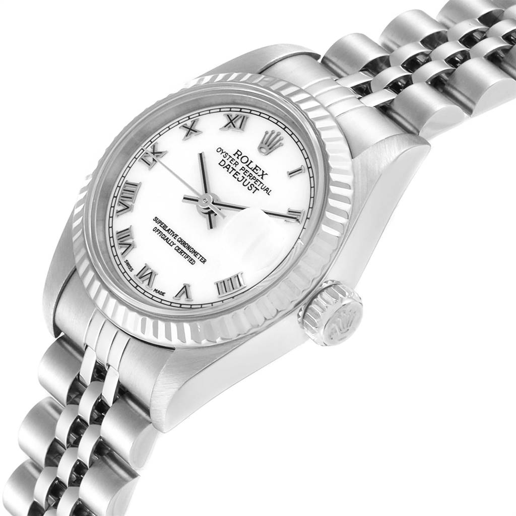 This image shows a Rolex Datejust 79174 Women's Stainless Steel White Dial 79174 Women's Stainless Steel White Dial watch from an angled side view, highlighting the face, fluted bezel, and part of the bracelet.