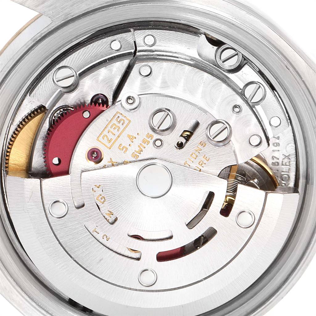 The image shows a close-up view of the movement mechanism of a Rolex Datejust 69173 Women
s Stainless Steel Silver Dial 69173 Women
s Stainless Steel Silver Dial watch.