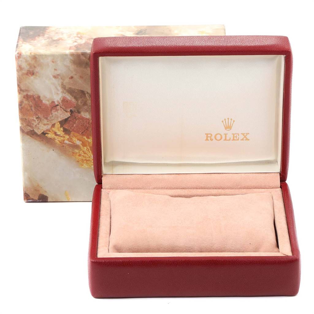 This image shows an open Rolex Datejust 69173 Women
s Stainless Steel Silver Dial 69173 Women
s Stainless Steel Silver Dial watch box with a red exterior and beige interior, branded with the Rolex logo.