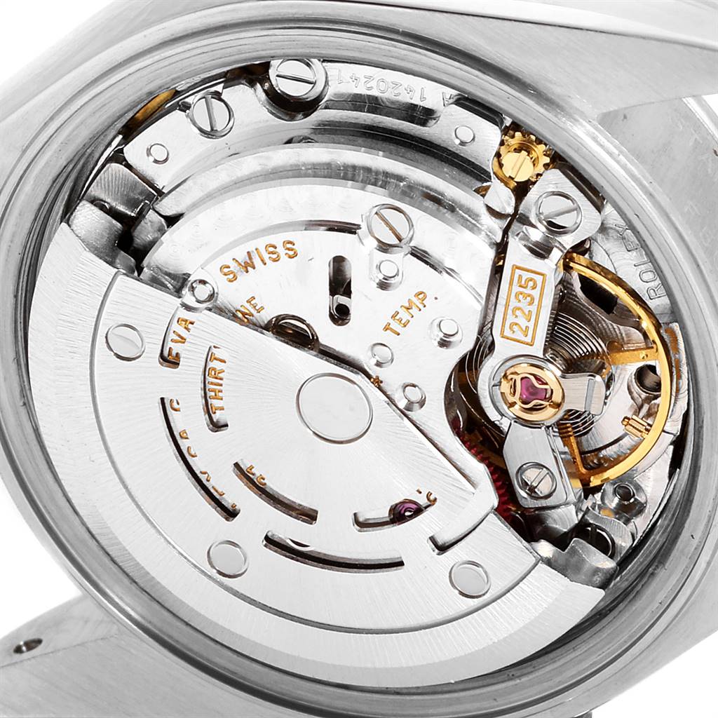 This image shows a close-up of the movement mechanism of a Rolex Datejust 79174 Women
s Stainless Steel Mother of Pearl Dial 79174 Women
s Stainless Steel Mother of Pearl Dial watch, highlighting the intricate inner components.