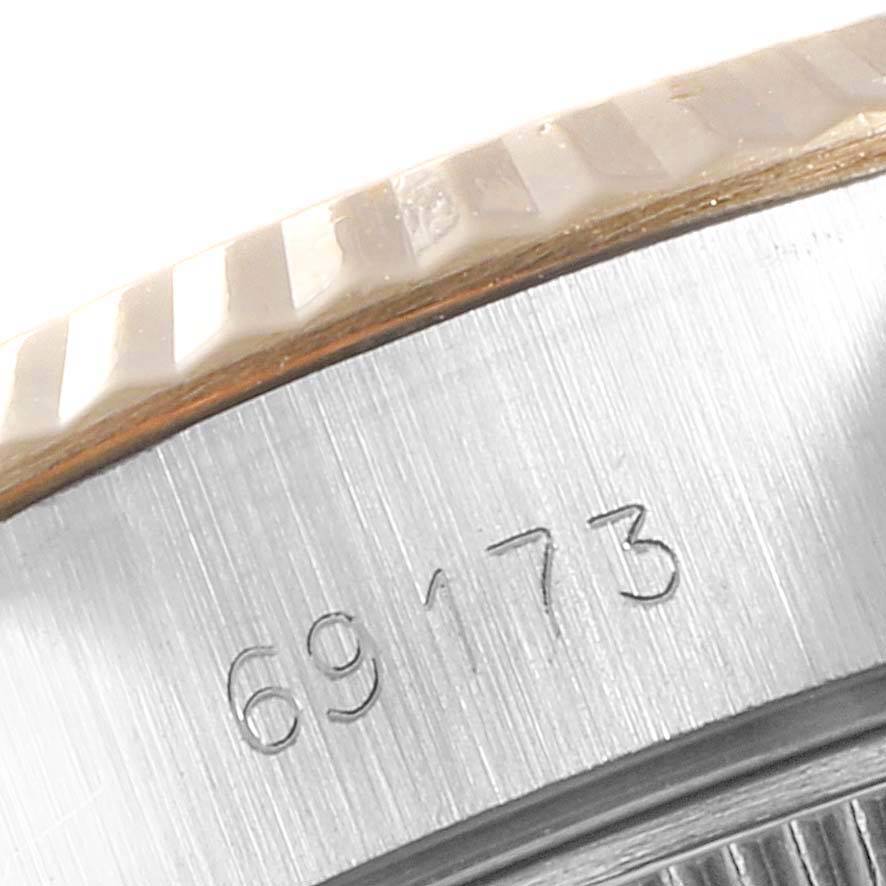 This close-up angle shows the engraved reference number "69173" and part of the fluted bezel of the Rolex Datejust 69173 Women
s Stainless Steel Black Dial 69173 Women
s Stainless Steel Black Dial.