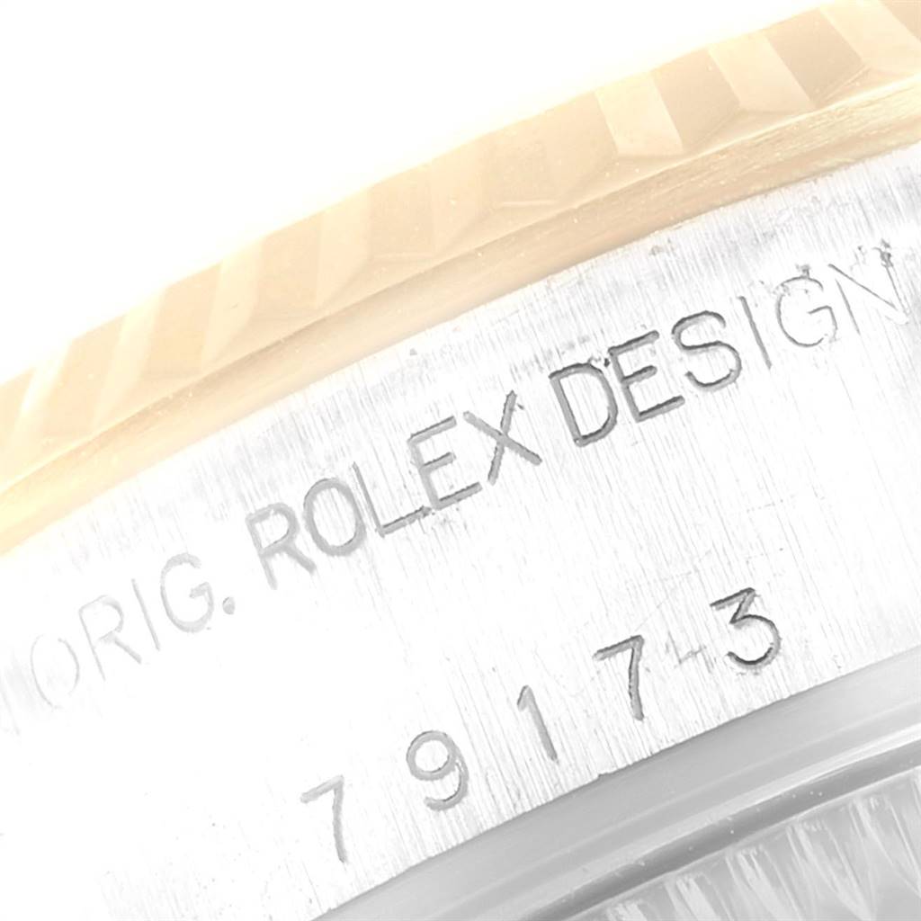 This image shows a close-up of the side engraving on a Rolex Datejust 79173 Women
s Stainless Steel Blue Dial 79173 Women
s Stainless Steel Blue Dial watch.