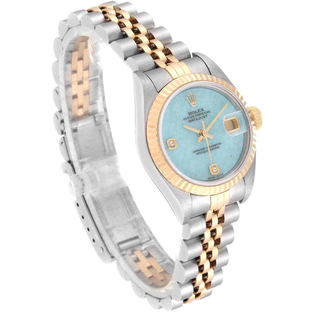 The image shows a Rolex Datejust 79173 Women
s Stainless Steel Blue Dial 79173 Women
s Stainless Steel Blue Dial watch at a 3/4 angle, highlighting its face, two-tone bracelet, and fluted bezel.