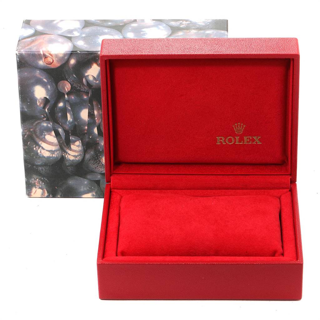 The image shows an empty red Rolex watch box for the Datejust model, with "Rolex" logo inside.